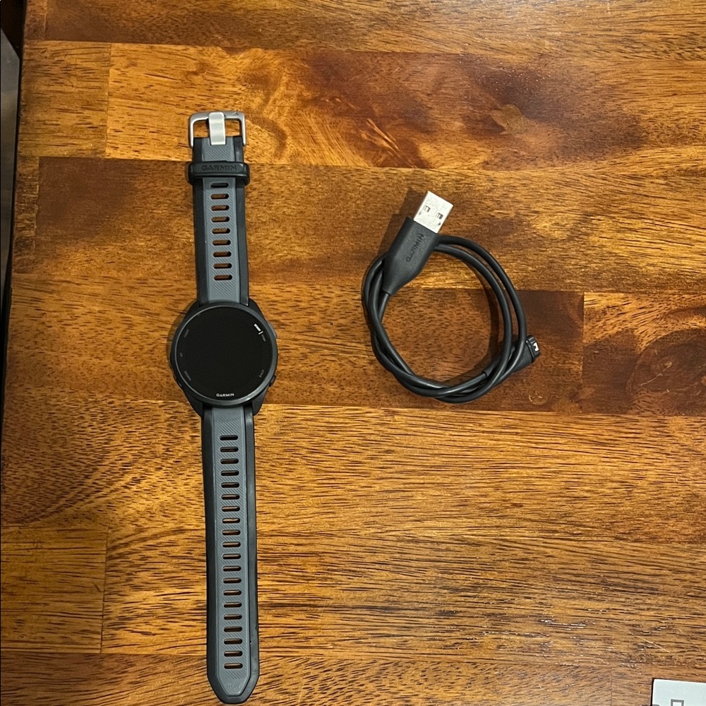 Garmin Forerunner 165 with charging cable